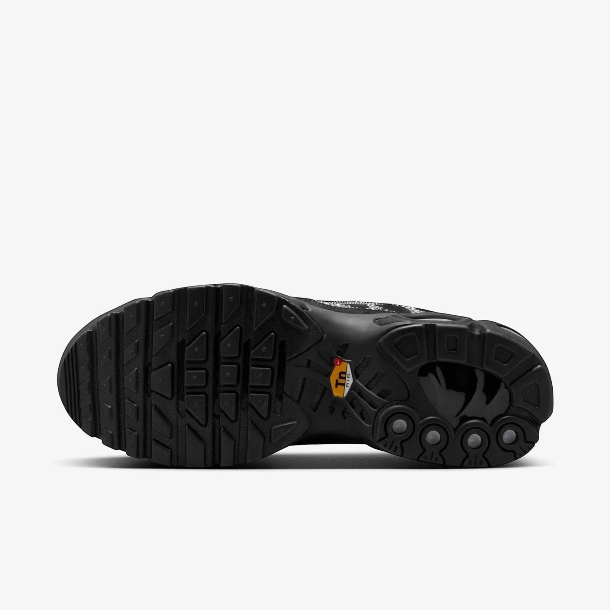 Bottom view of the Nike Air Max Plus TN x Swarovski sneaker featuring a textured black outsole.