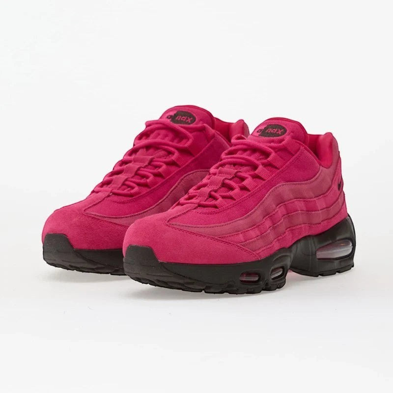 Nike Air Max 95 OG Fireberry sneakers in vibrant pink color with layered design and black accents.